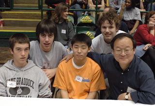 Ilryong with his son and classmates at a school basketball game